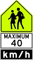 Fluorescent yellow-green sign with two walking figures above a panel reading MAXIMUM 40 km/h.