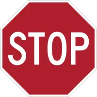 Red octagonal sign with white capital letters spelling STOP.
