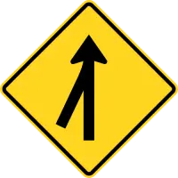 Yellow diamond sign with a black line joining a second line from the right into one.